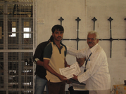 11th July 2014, Performance Day: Sri Raveendranatha C. N, Joint Director, ESIC distributes a prize.
